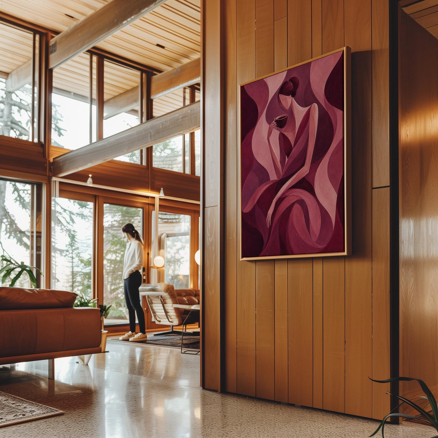 Woman sipping coffee among soft burgundy waves, canvas print presented in a light, minimal room
