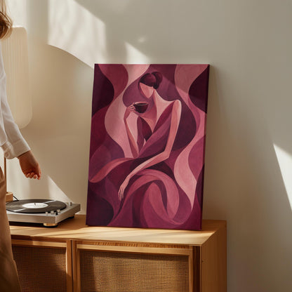Woman sipping coffee among soft burgundy waves, canvas print styled against a soft white wall