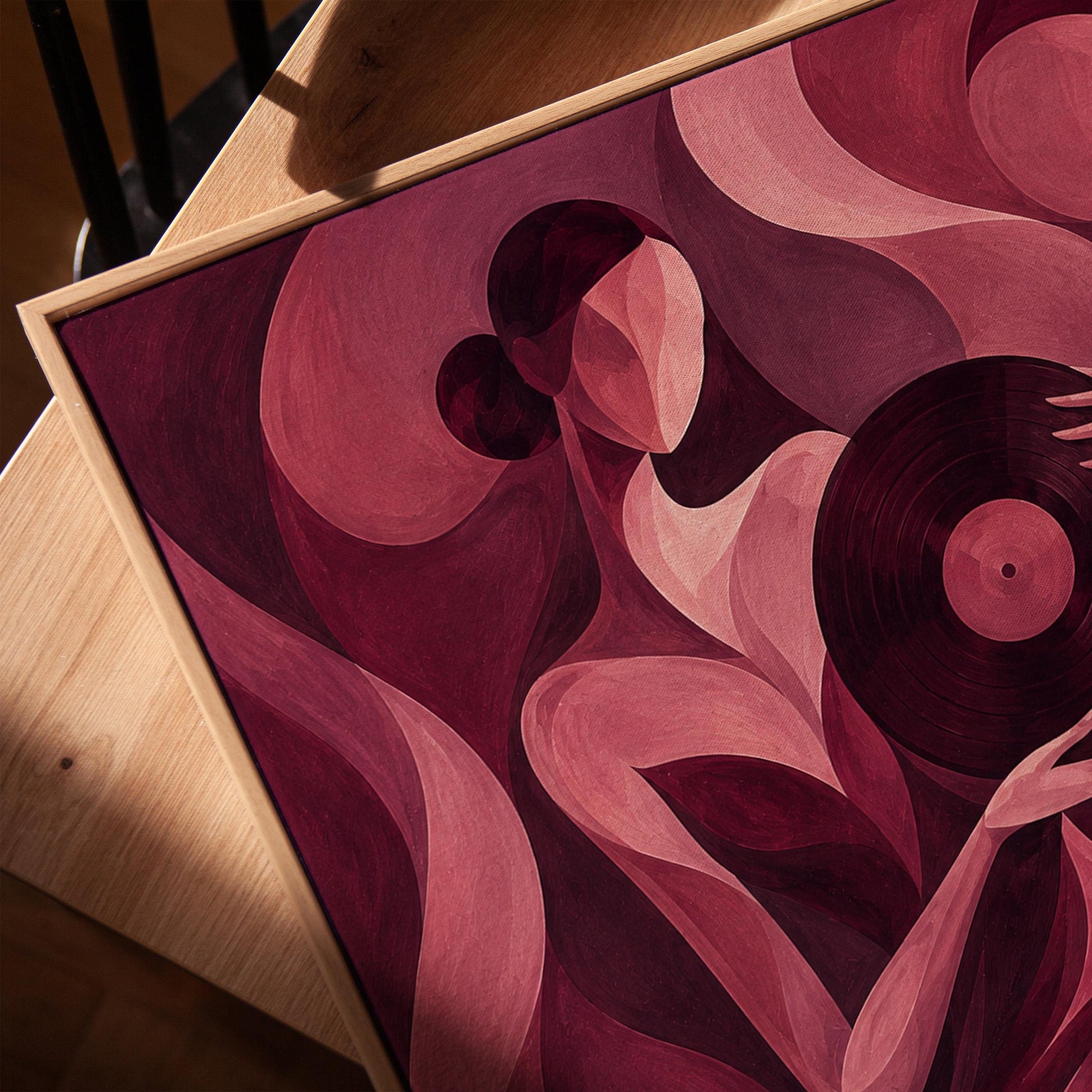 Woman holding vinyl record in burgundy deco style, canvas print in a warm, minimally styled interior