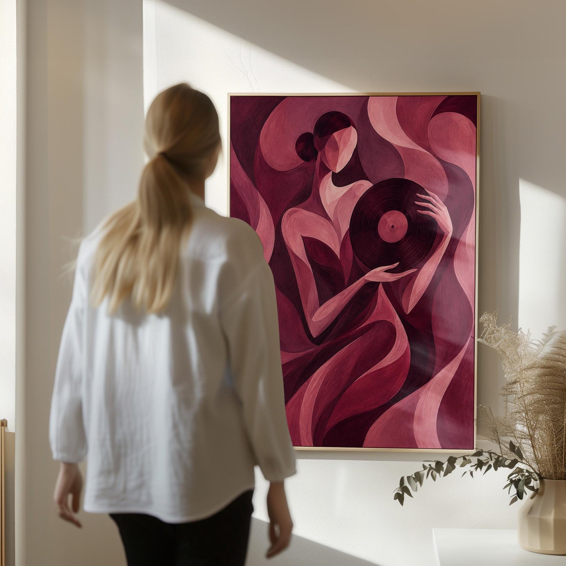 Woman holding vinyl record in burgundy deco style, canvas print seen in a warm interior with natural light