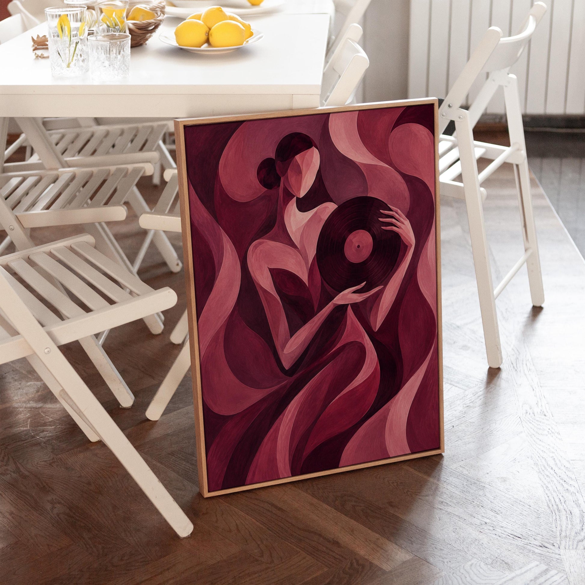 Woman holding vinyl record in burgundy deco style, canvas print hanging in a calm, modern living space