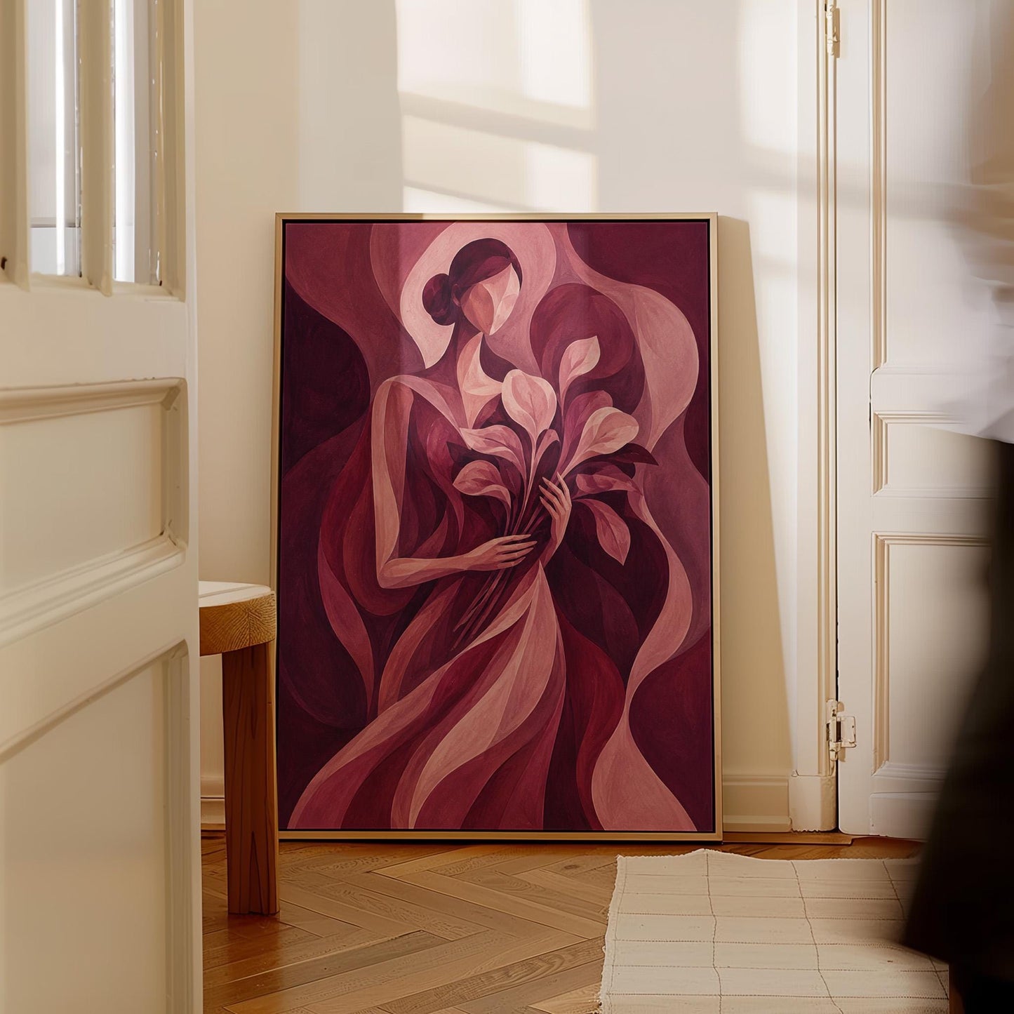 Woman holding tulips among burgundy waves, canvas wall art seen in a warm interior with natural light