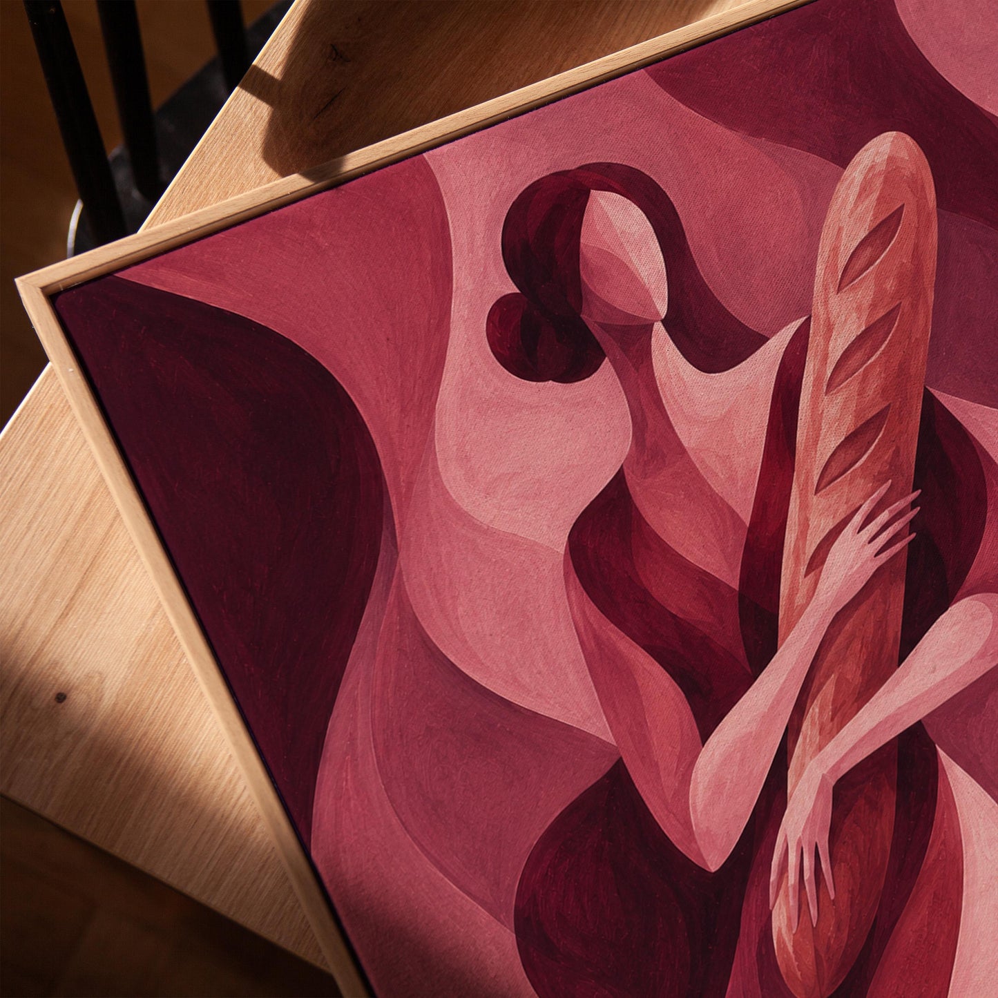 Woman holding baguette in burgundy deco style, canvas print in a warm, minimally styled interior