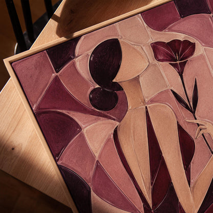 Woman holding poppies in cubist burgundy and cream, canvas print in a warm, minimally styled interior