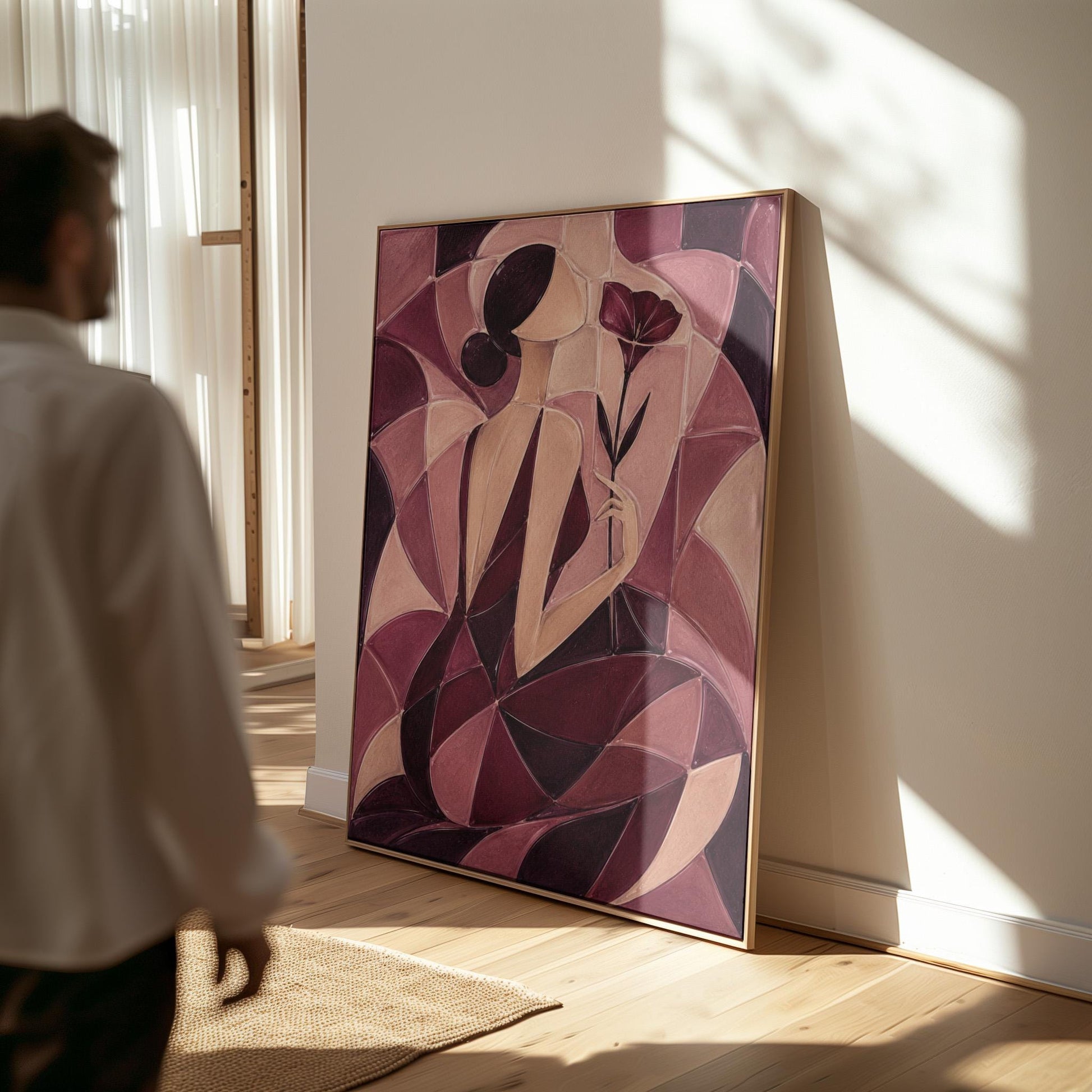 Woman holding poppies in cubist burgundy and cream, canvas print shown in a sunlit, contemporary room