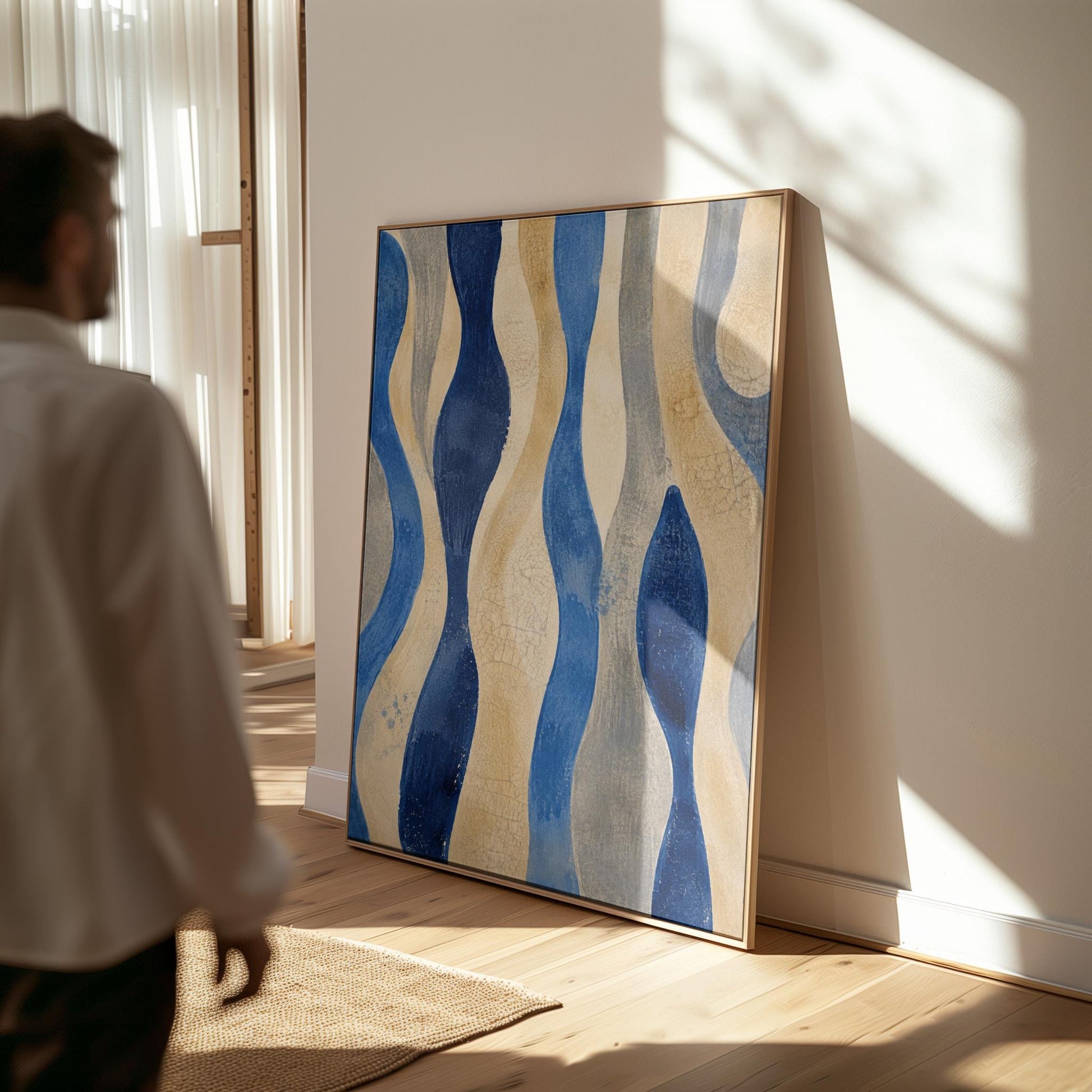 Vertical flowing wave bands in indigo and cream, canvas wall art hanging in a calm, modern living space