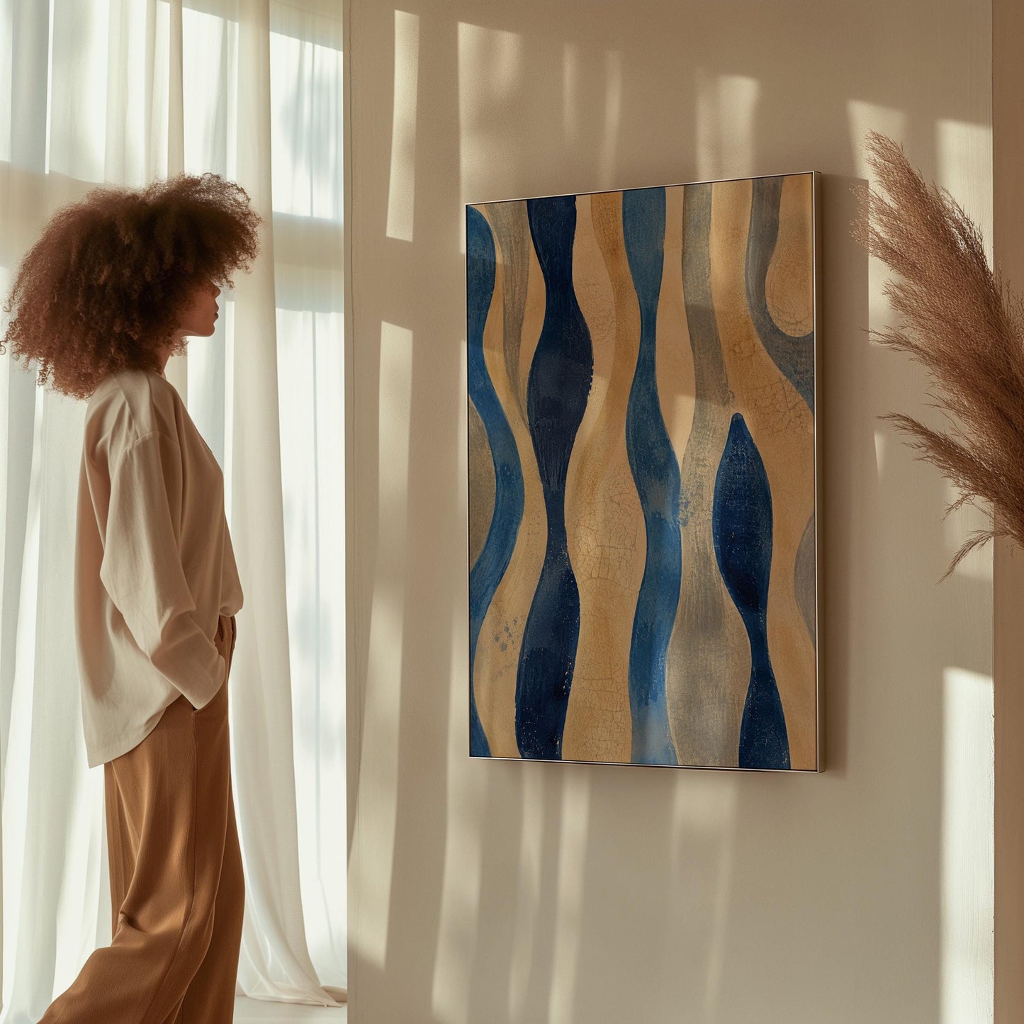 Vertical flowing wave bands in indigo and cream, canvas print seen in a warm interior with natural light