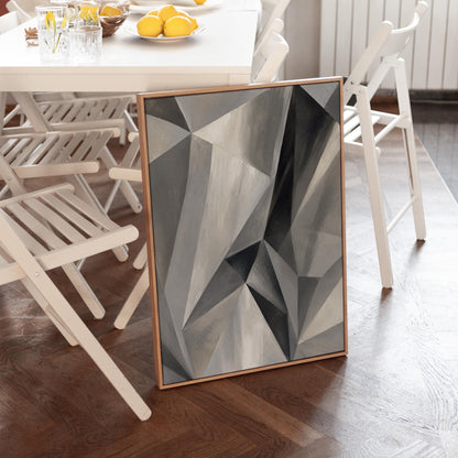 Angular graphite planes with sharp light play, canvas print hanging in a calm, modern living space