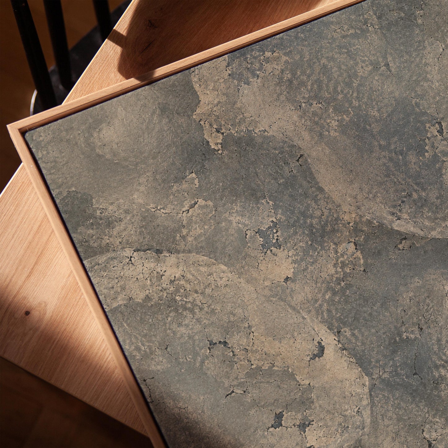 Layered misty gray cloud forms, canvas print in a warm, minimally styled interior
