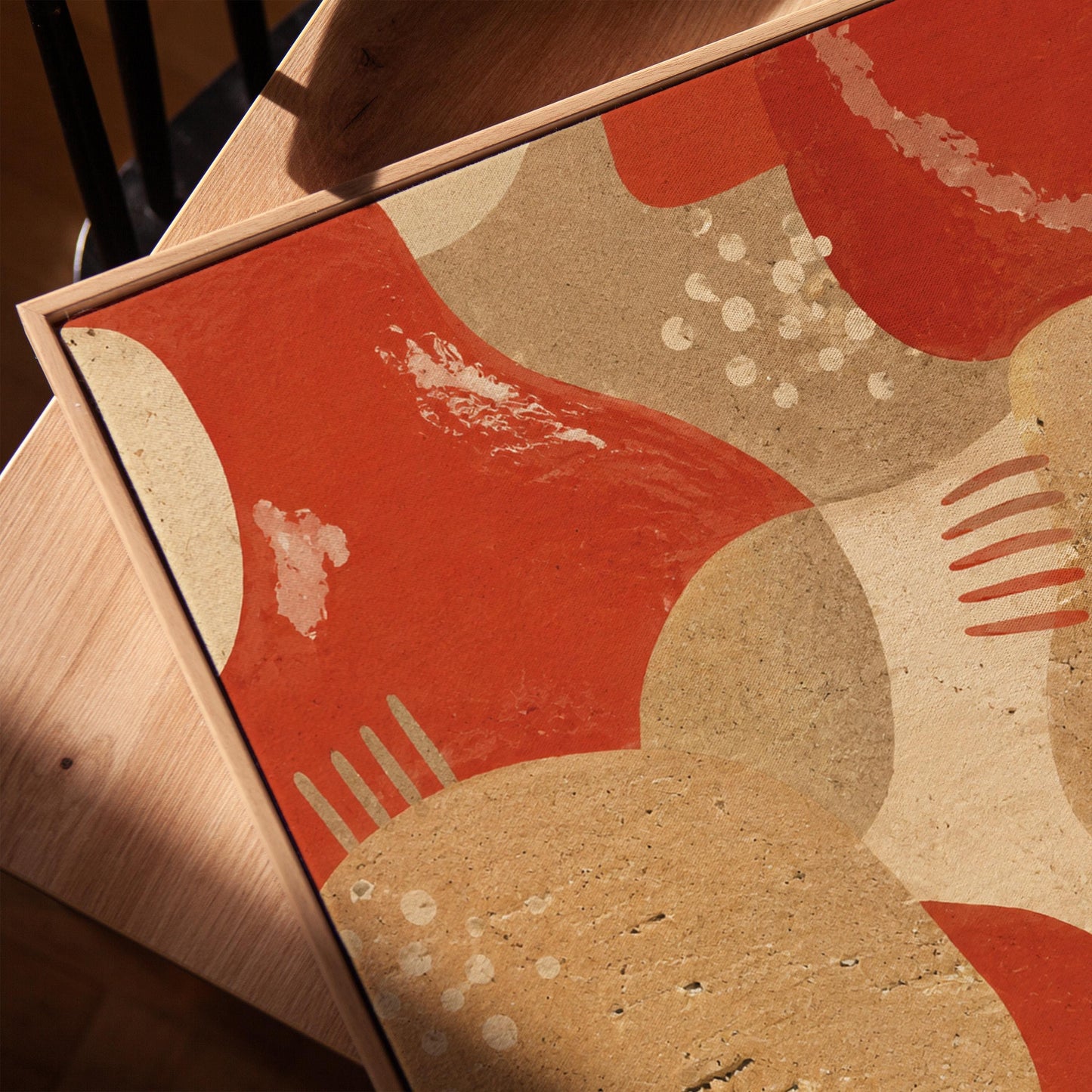 Interlocking terracotta and beige organic shapes, canvas print in a warm, minimally styled interior
