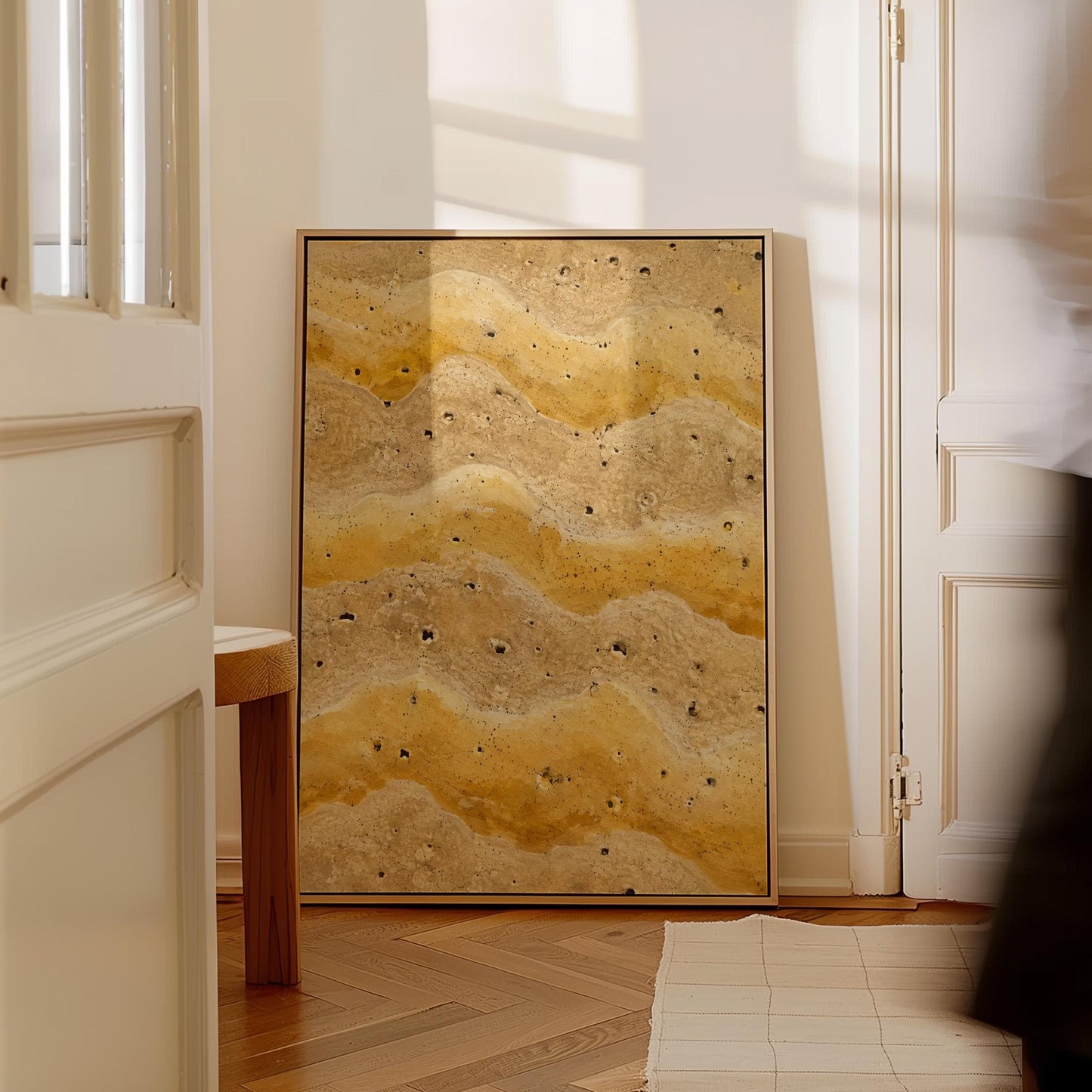 Flowing golden ochre wave layers, canvas print hanging in a calm, modern living space
