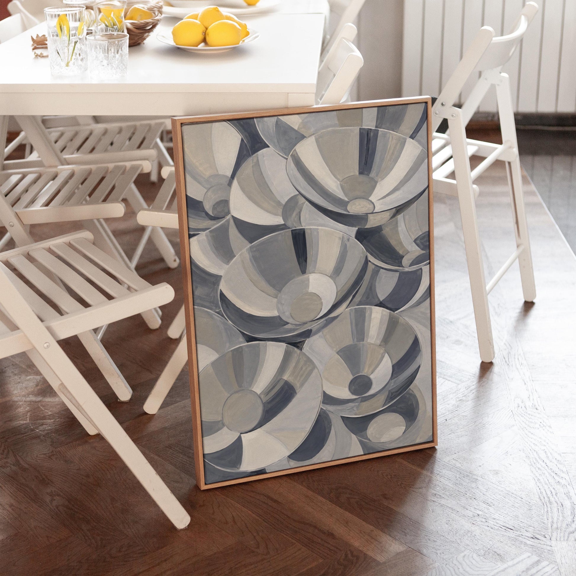 Nested silver bowl curves overlapping rhythmically, canvas print styled against a soft white wall