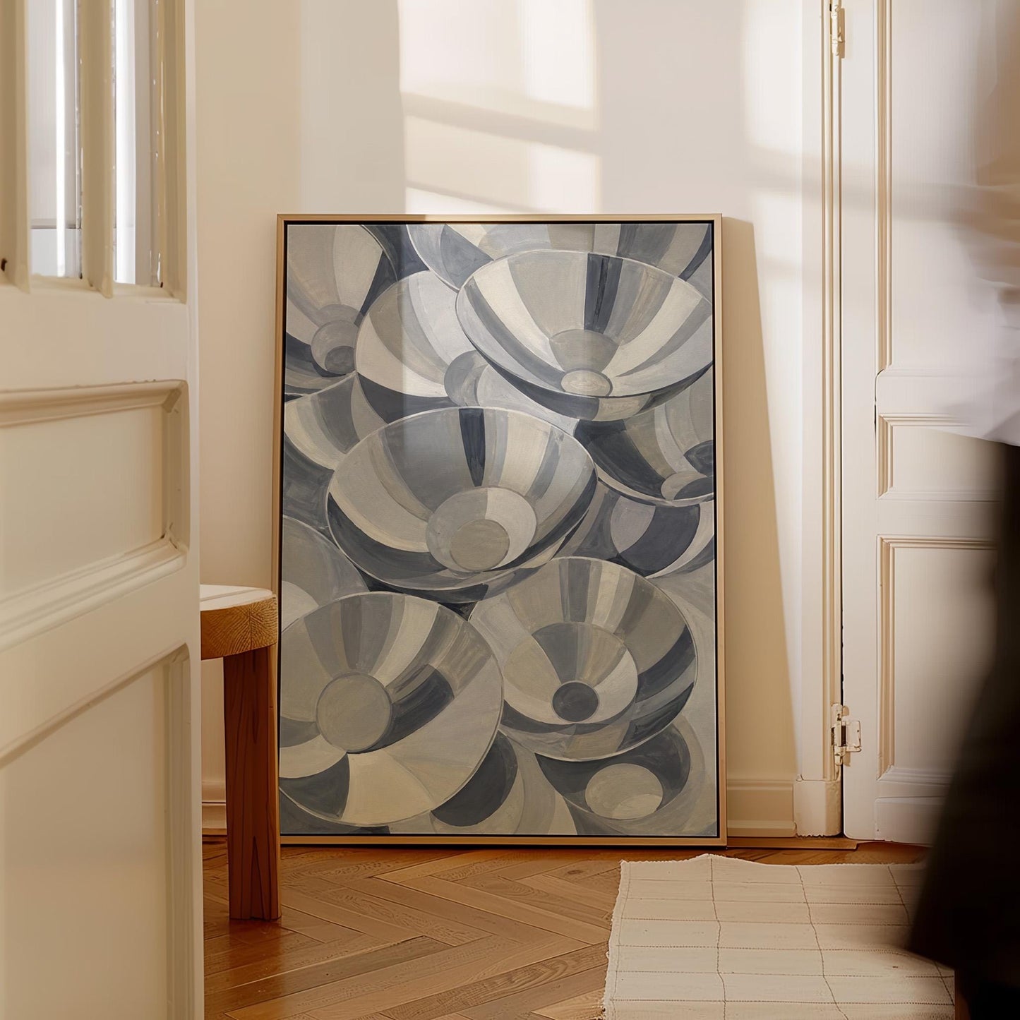 Nested silver bowl curves overlapping rhythmically, canvas print on a quiet wall in a considered interior