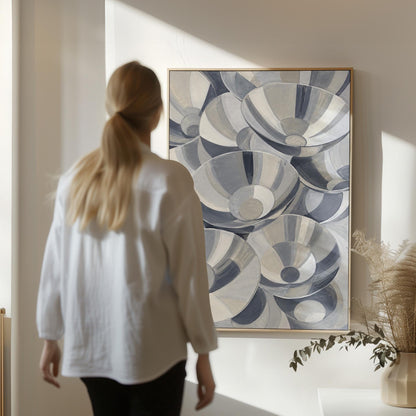 Nested silver bowl curves overlapping rhythmically, canvas wall art styled against a soft white wall