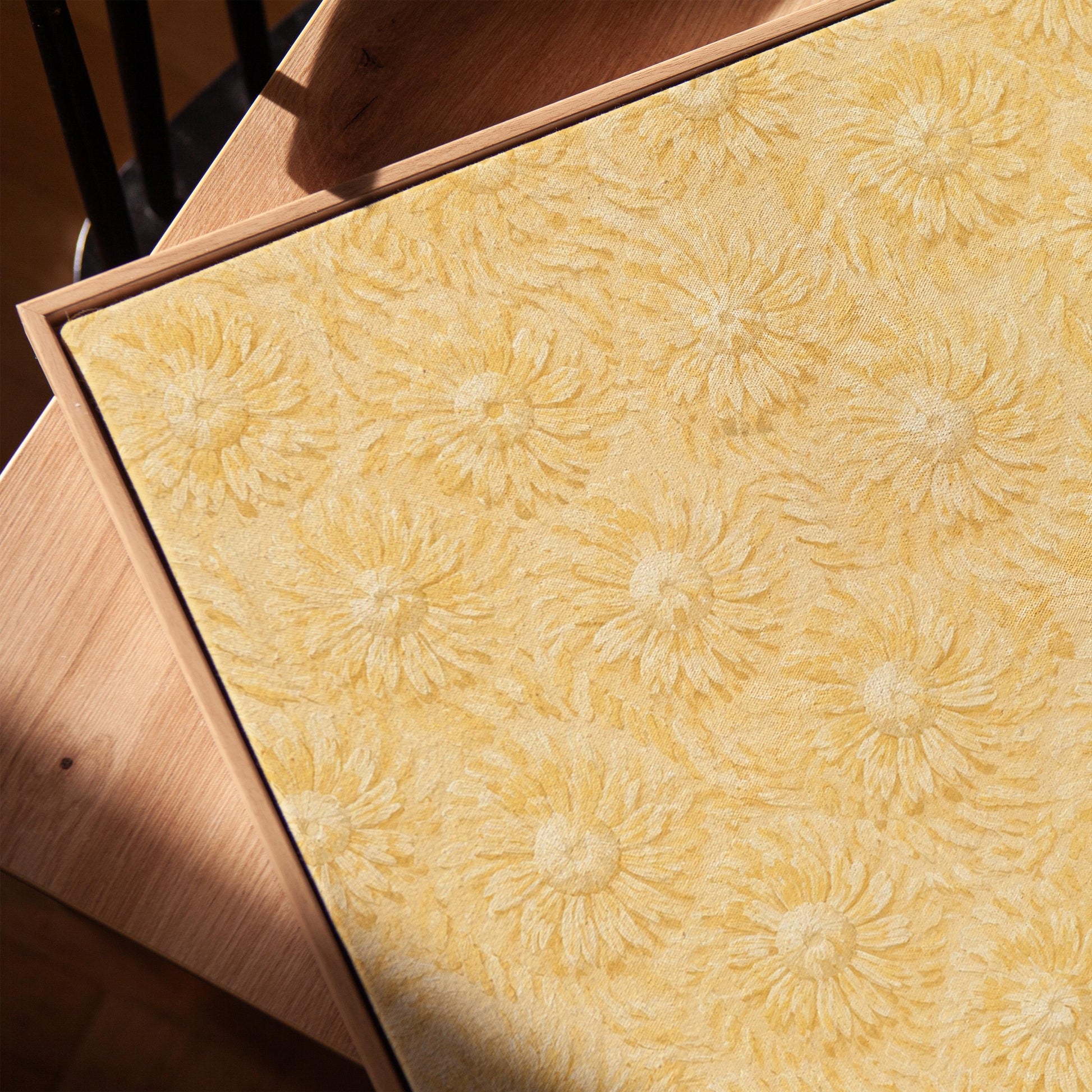 Field of soft butter yellow daisies pattern, canvas print in a warm, minimally styled interior