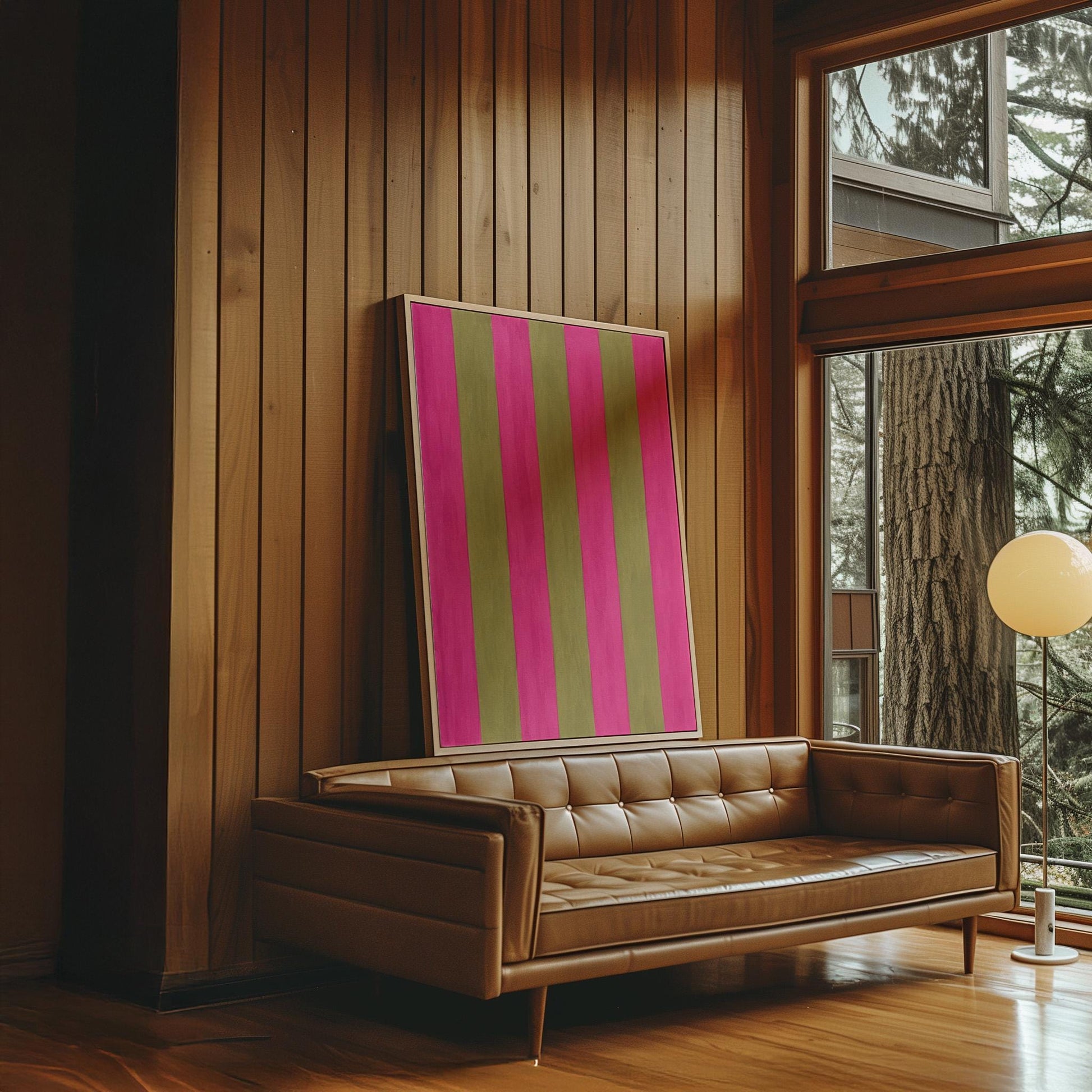 Bold vertical stripes in hot pink and olive green, canvas print on a quiet wall in a considered interior