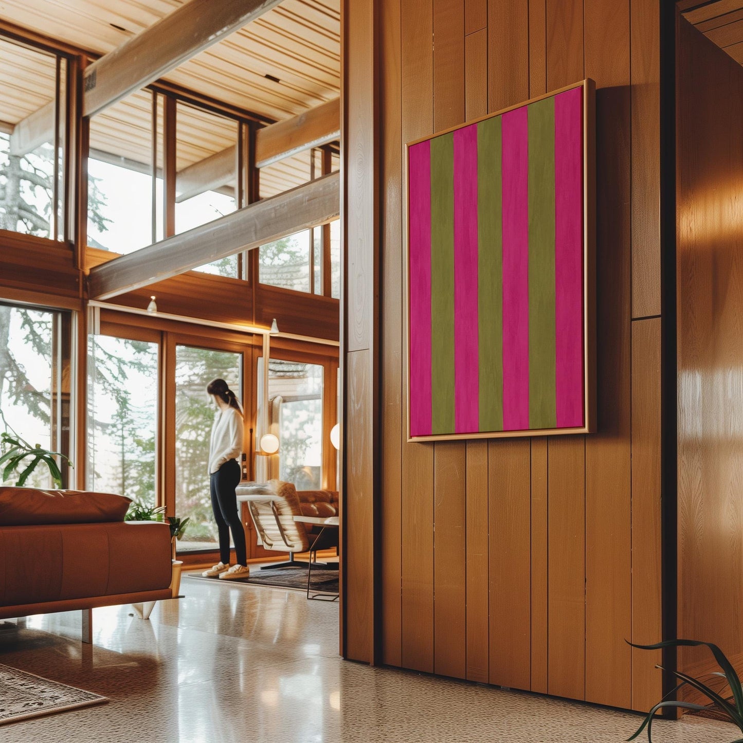 Bold vertical stripes in hot pink and olive green, canvas print seen in a warm interior with natural light