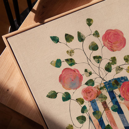 Climbing roses around a striped collage vase, canvas print in a warm, minimally styled interior