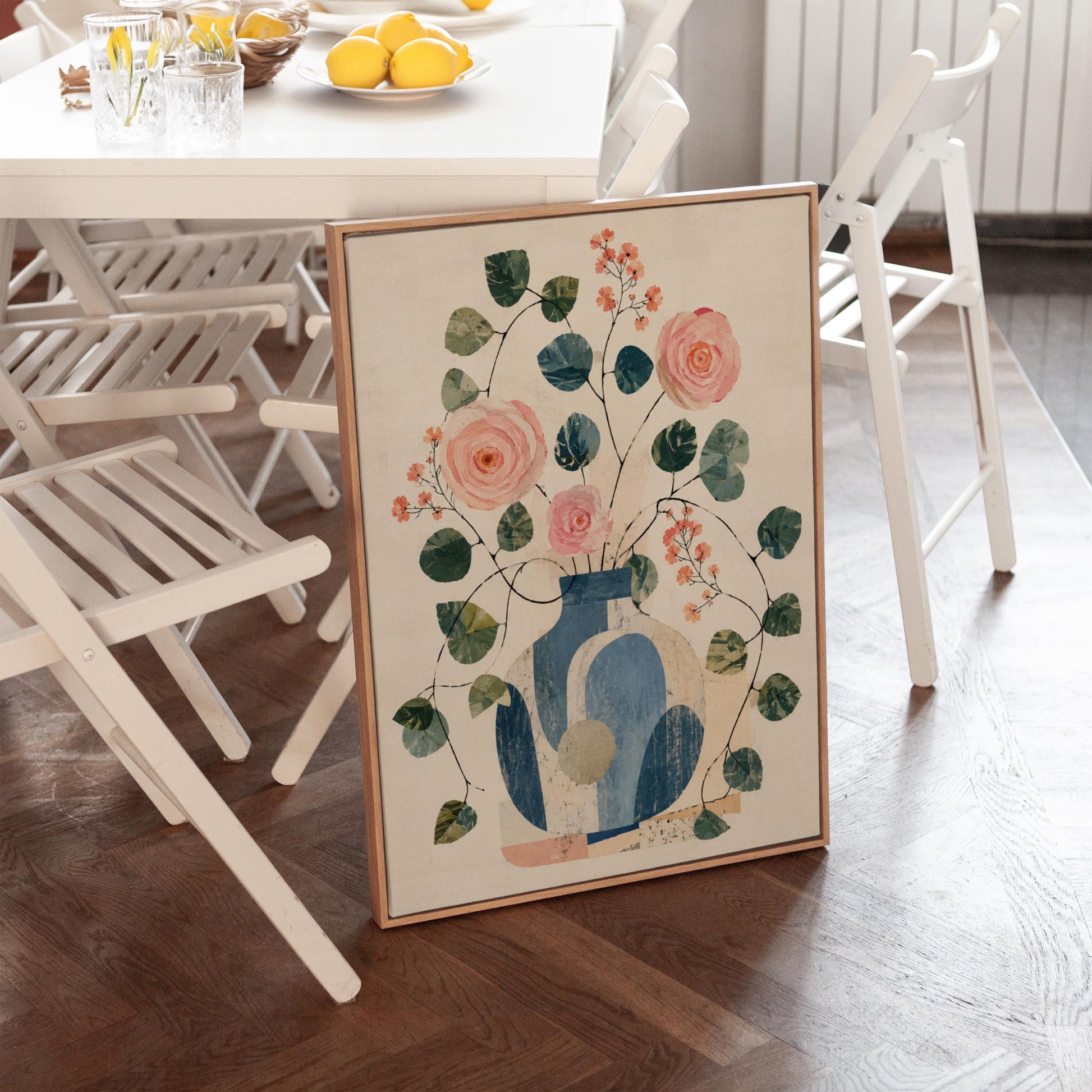 Roses and sprigs in two blue collage vases, canvas print shown in a sunlit, contemporary room