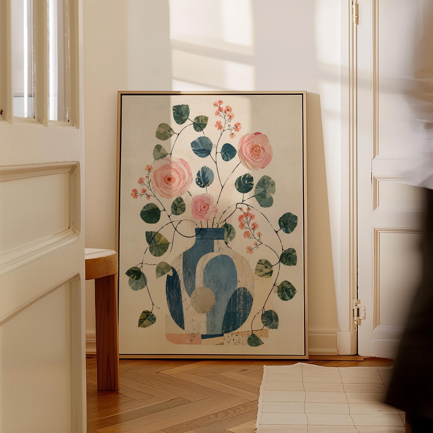 Roses and sprigs in two blue collage vases, canvas print presented in a light, minimal room