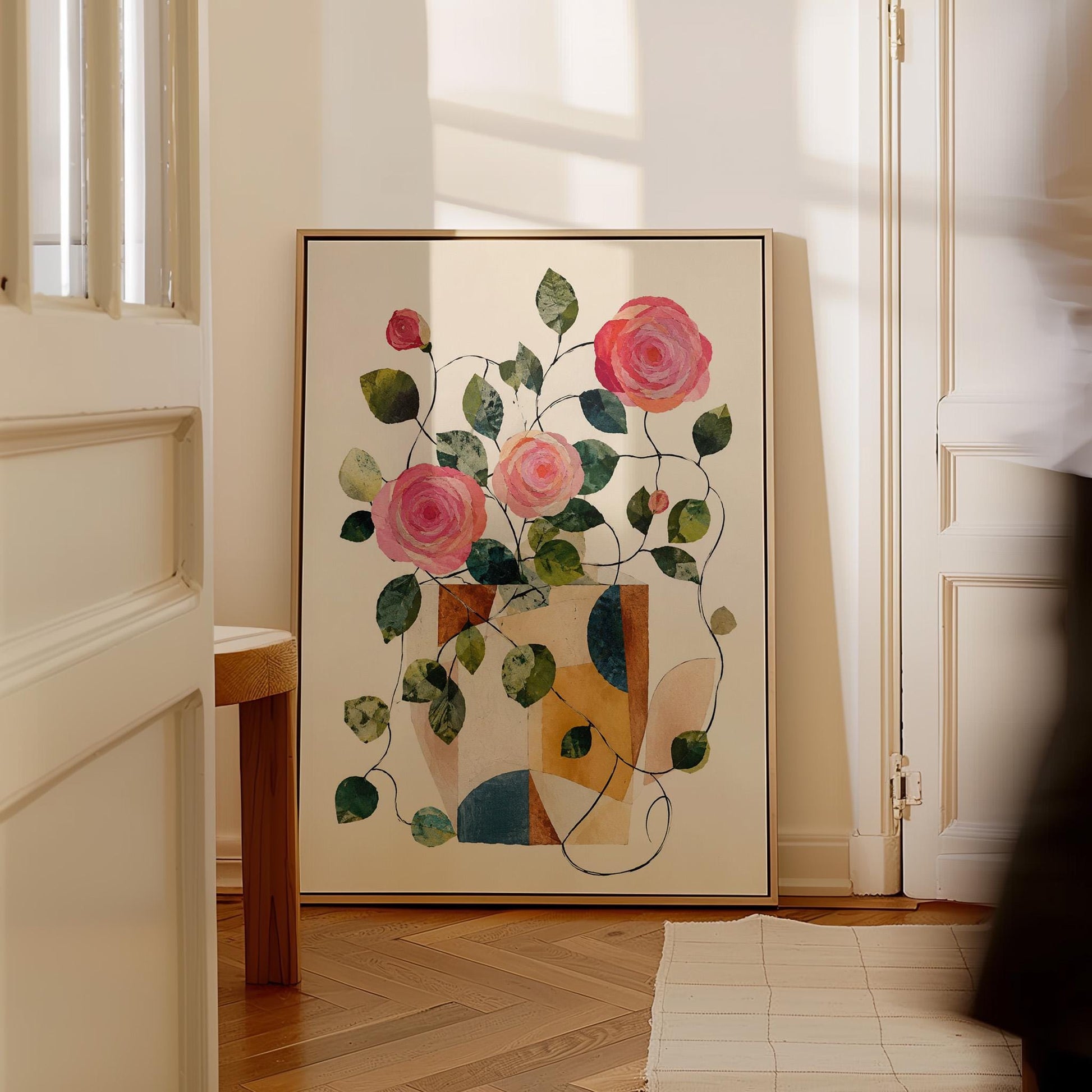Lush roses spilling from geometric collage vase, canvas wall art presented in a light, minimal room