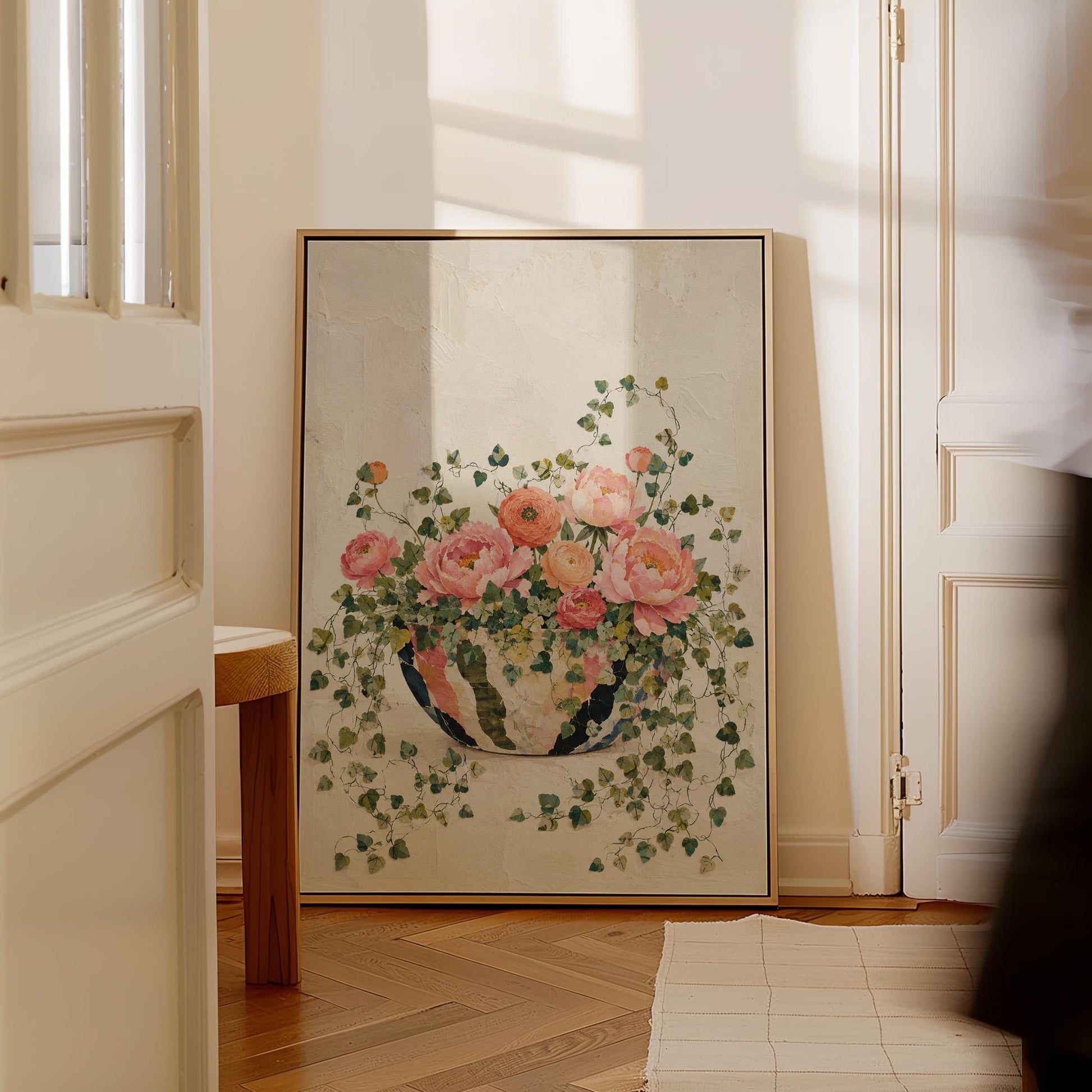 Blush peonies in bowl with cascading ivy, canvas wall art styled against a soft white wall