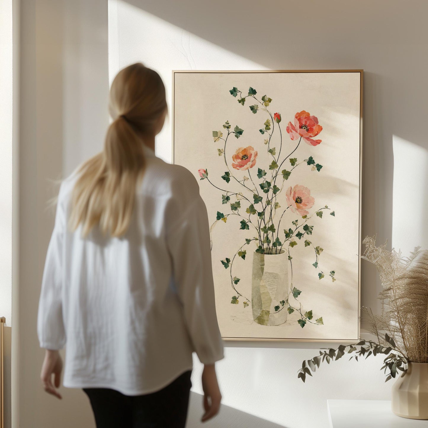 Coral poppies with ivy stems in slender vase, canvas print seen in a warm interior with natural light