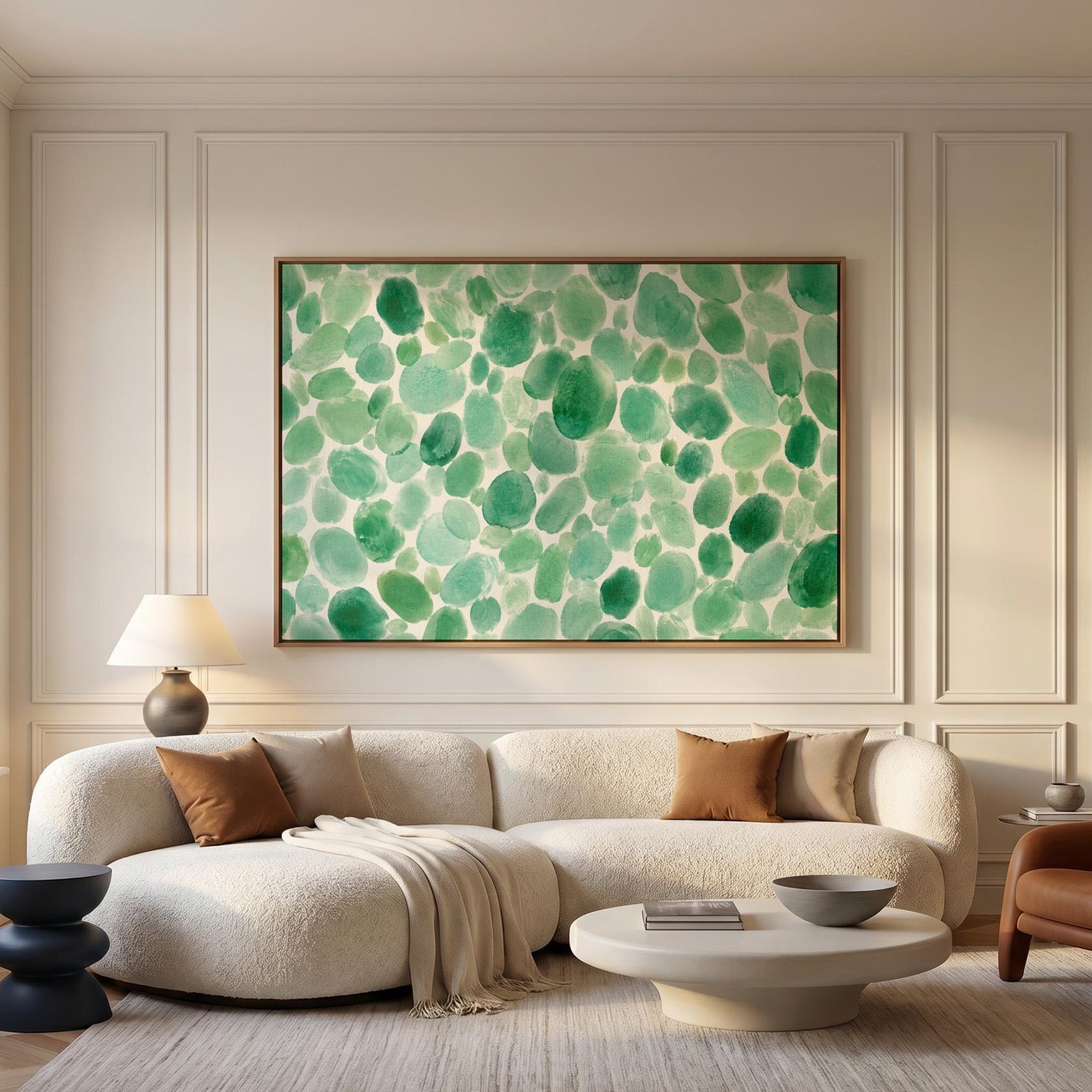 Field of green watercolor pebbles spread wide, canvas print presented in a light, minimal room