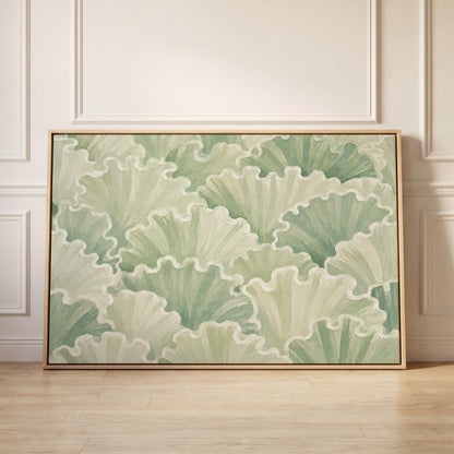 Ruffled leafy fan shapes in sage green rows, canvas print held up against a sunlit bedroom wall