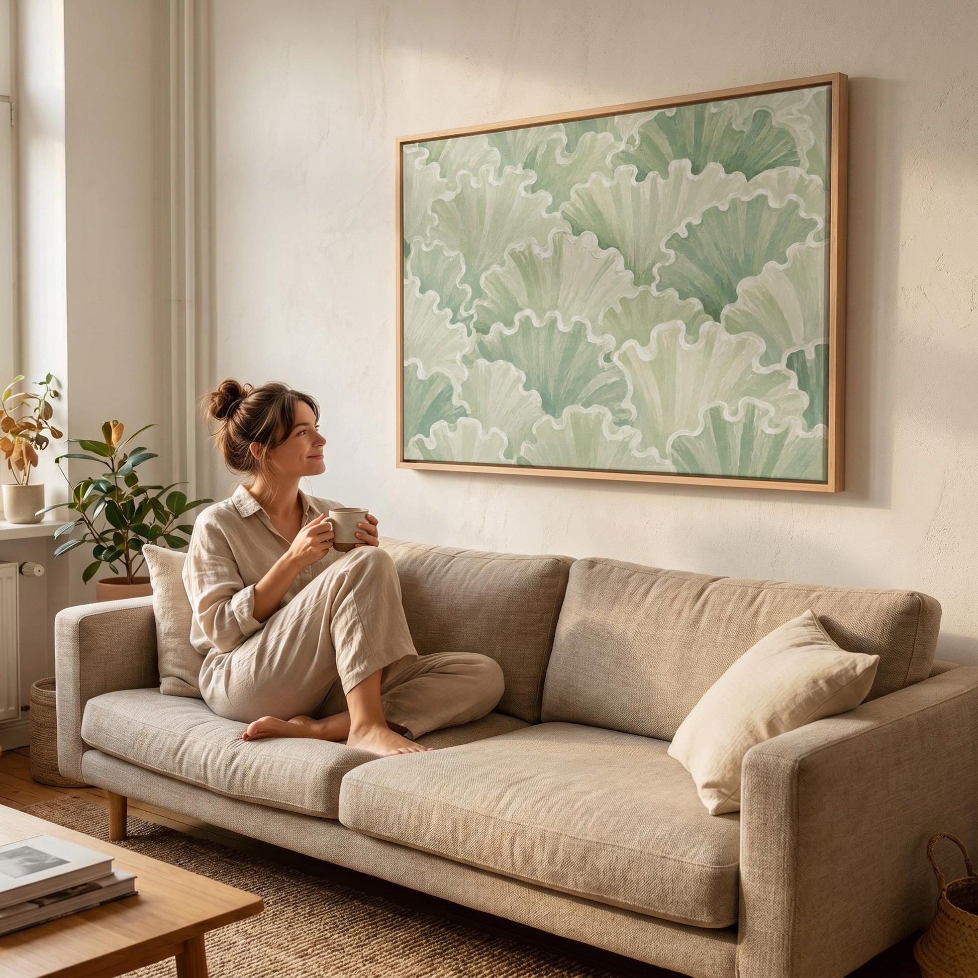 Ruffled leafy fan shapes in sage green rows, canvas print hanging in a calm, modern living space