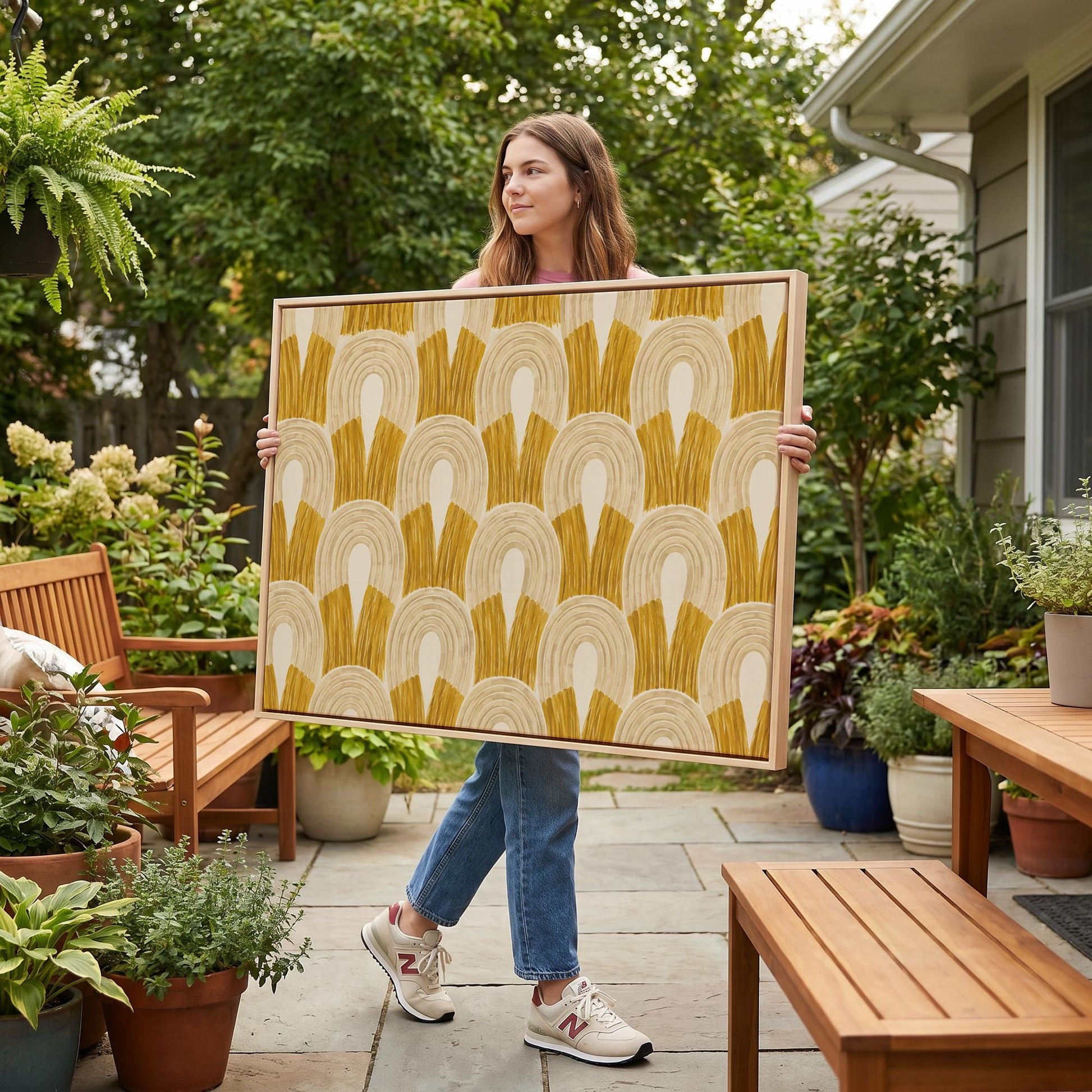 Rows of golden ochre arch shapes, canvas wall art seen in a warm interior with natural light