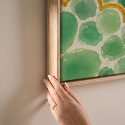 Green scallop scales with golden trim rows, canvas print shown at full size in a light-filled bedroom