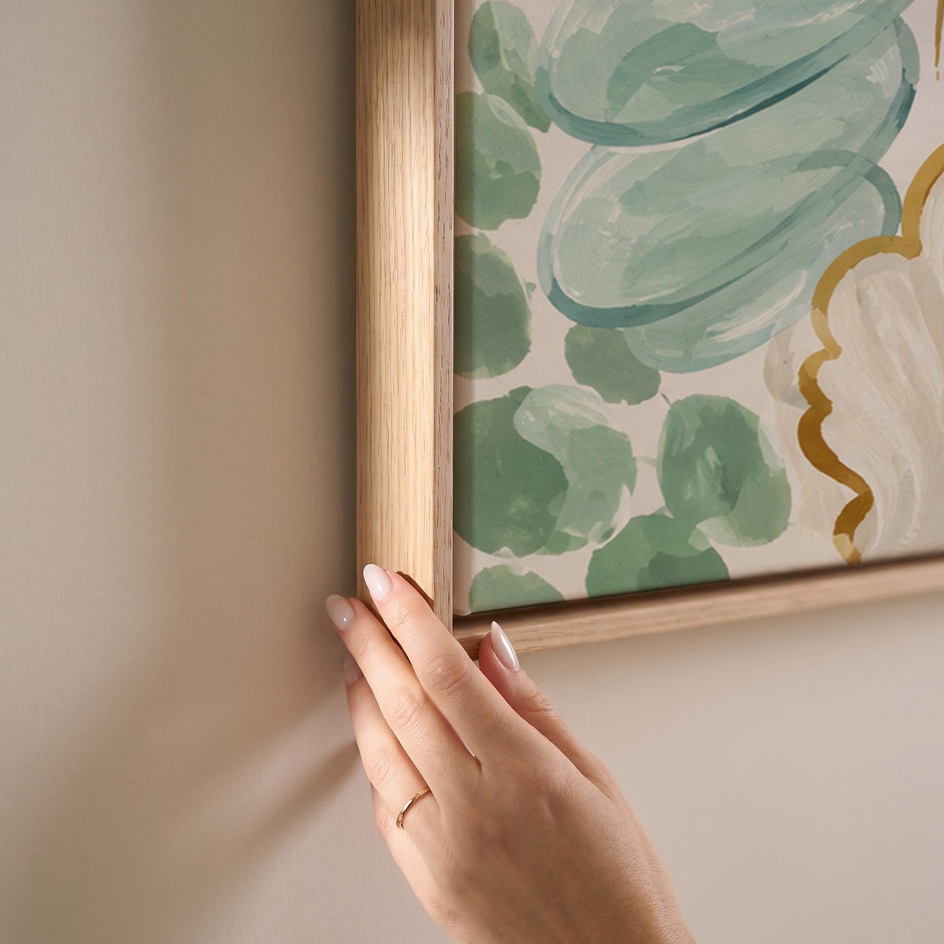 Celadon shapes with golden tassel ornaments, canvas print shown at full size in a light-filled bedroom