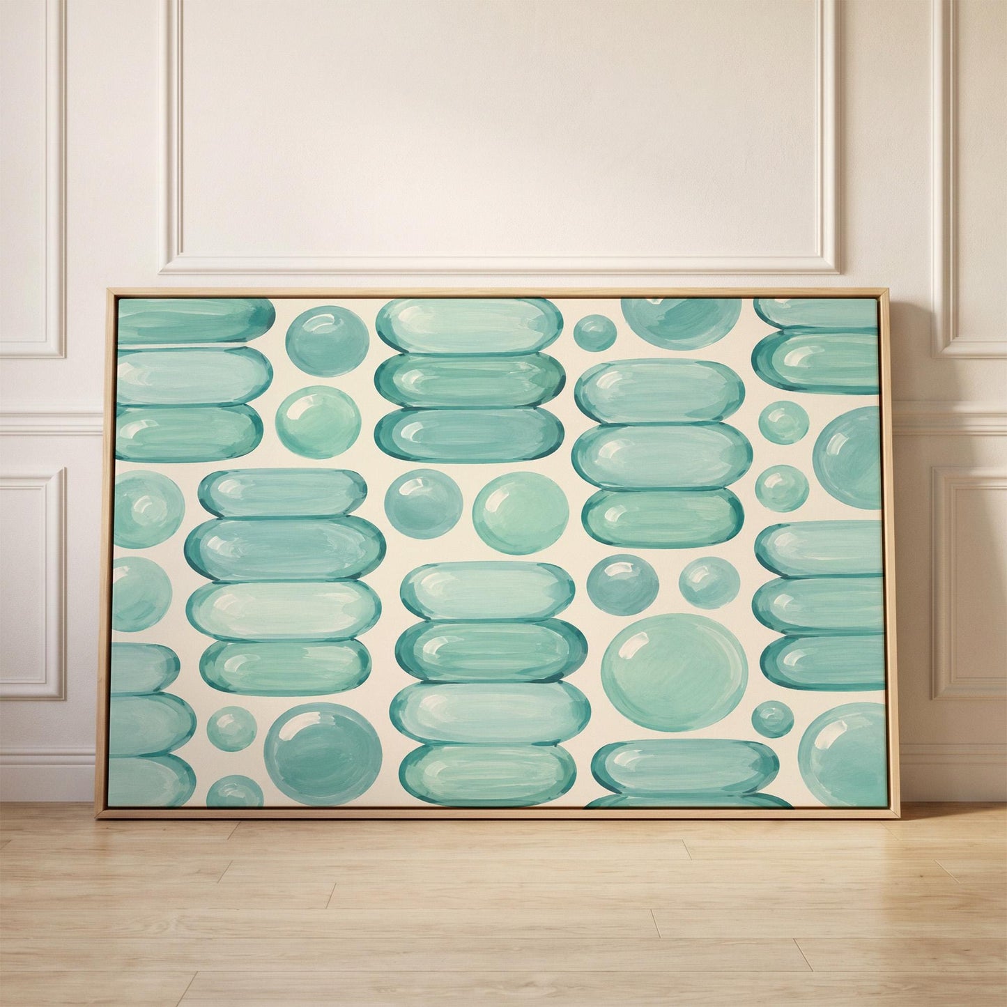 Rows of teal water drop and capsule shapes, canvas print held up against a sunlit bedroom wall