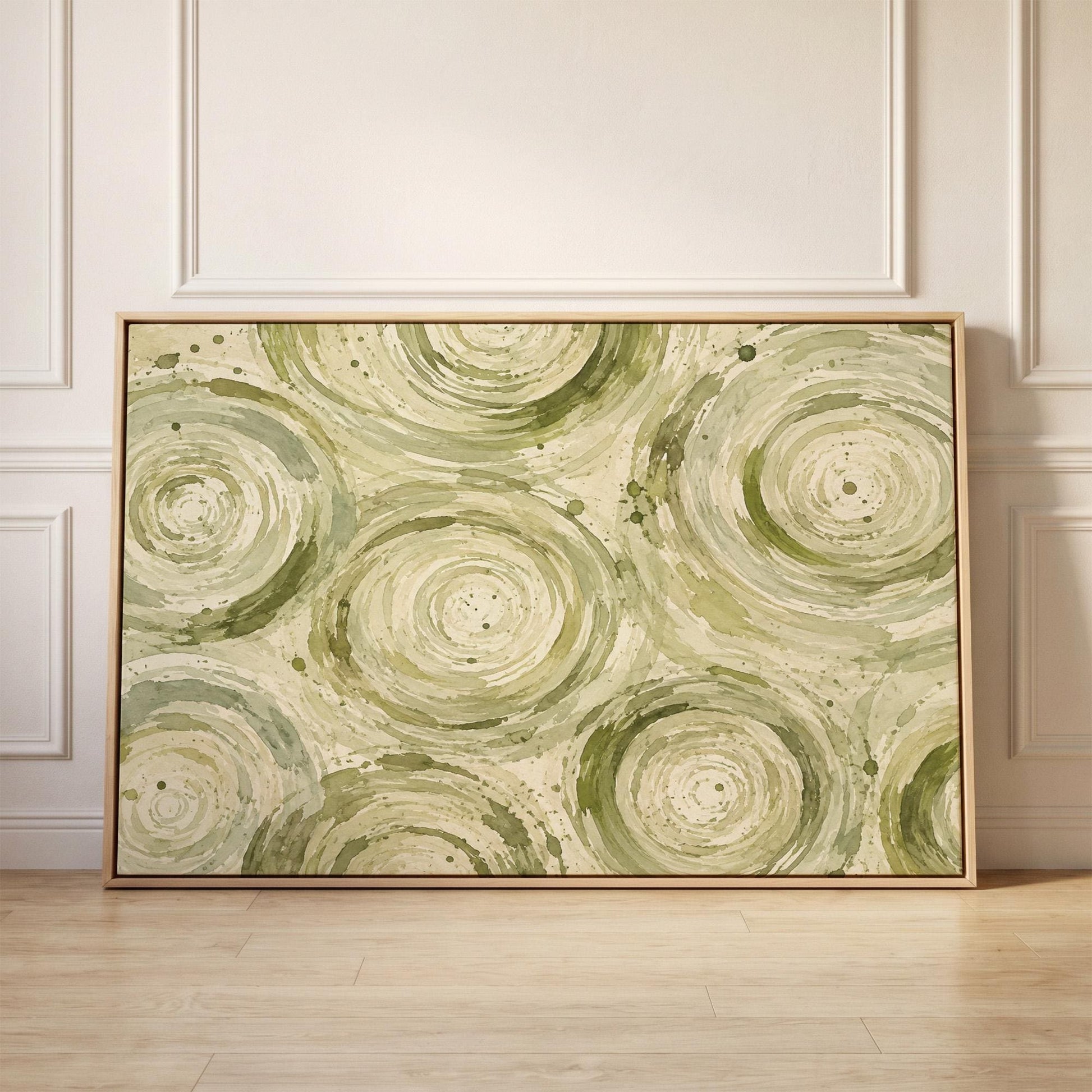 Swirling sage green ring circles, canvas print held up against a sunlit bedroom wall