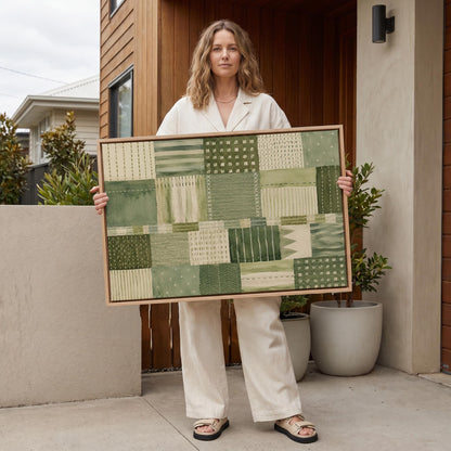 Quilted patchwork of olive green blocks, canvas print shown to scale in a furnished room