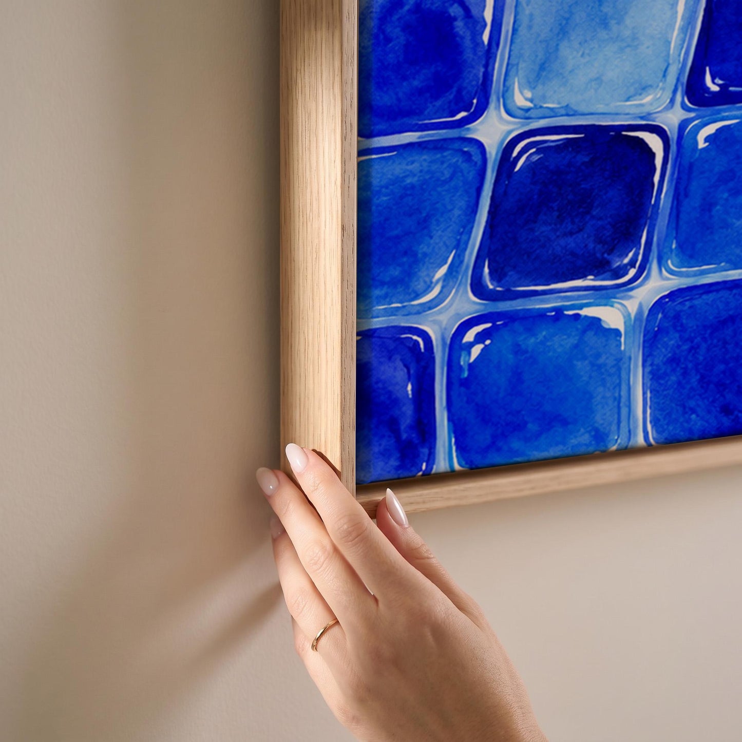 Deep sapphire mosaic tiles in wide grid, canvas print shown at full size in a light-filled bedroom