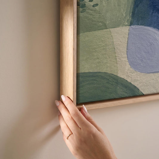 Soft muted shapes in dusty plum and sage, canvas print shown at full size in a light-filled bedroom