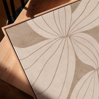 Abstract line drawing of oversized petals in cream and sand beige, canvas print in a warm, minimally styled interior