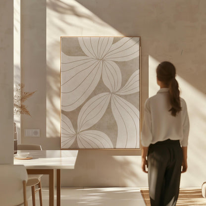 Abstract line drawing of oversized petals in cream and sand beige, canvas print seen in a warm interior with natural light