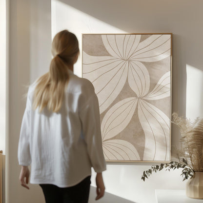Abstract line drawing of oversized petals in cream and sand beige, canvas wall art hanging in a calm, modern living space