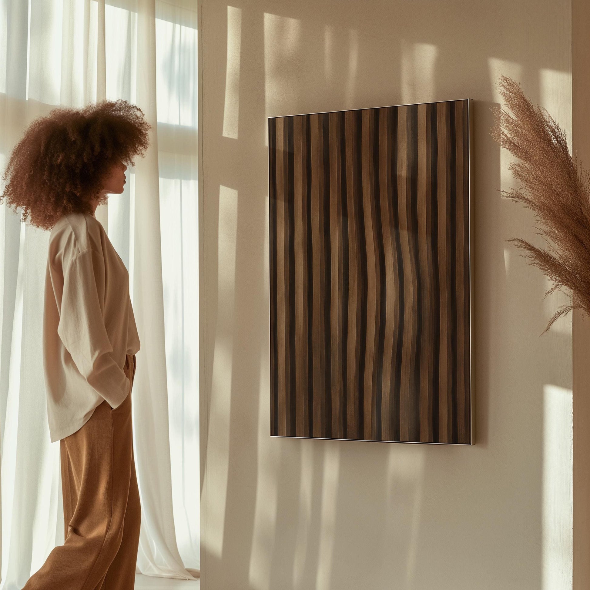 Vertical wavy stripes in dark walnut and coffee brown tones, canvas print presented in a light, minimal room