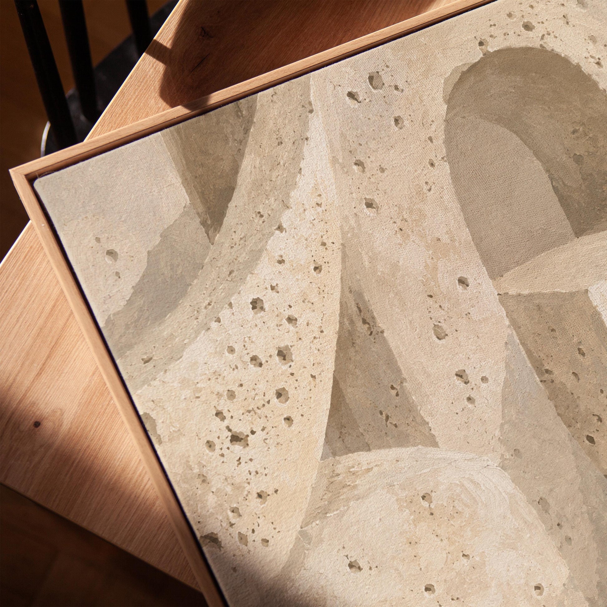 Interlocking arches and organic forms in warm speckled beige, canvas print in a warm, minimally styled interior