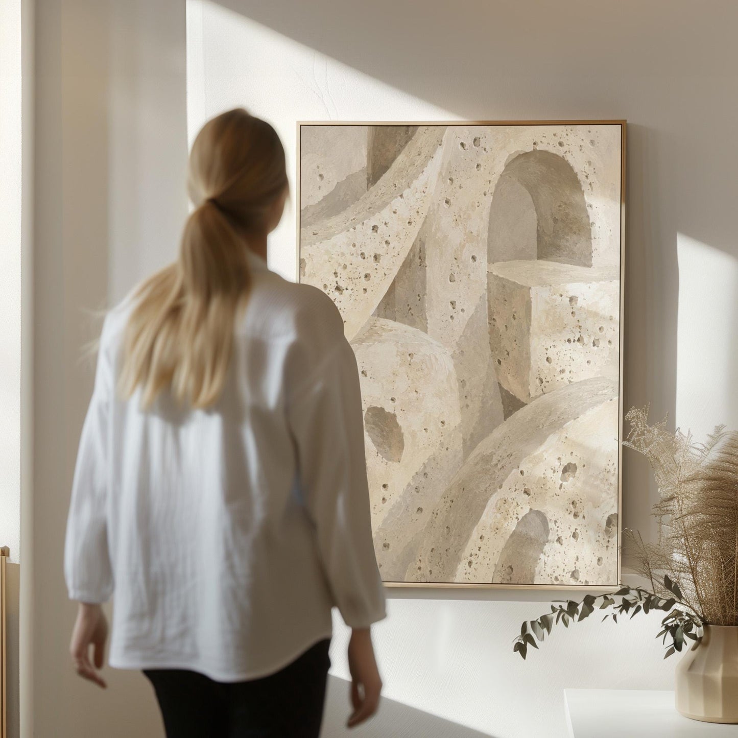 Interlocking arches and organic forms in warm speckled beige, canvas print on a quiet wall in a considered interior