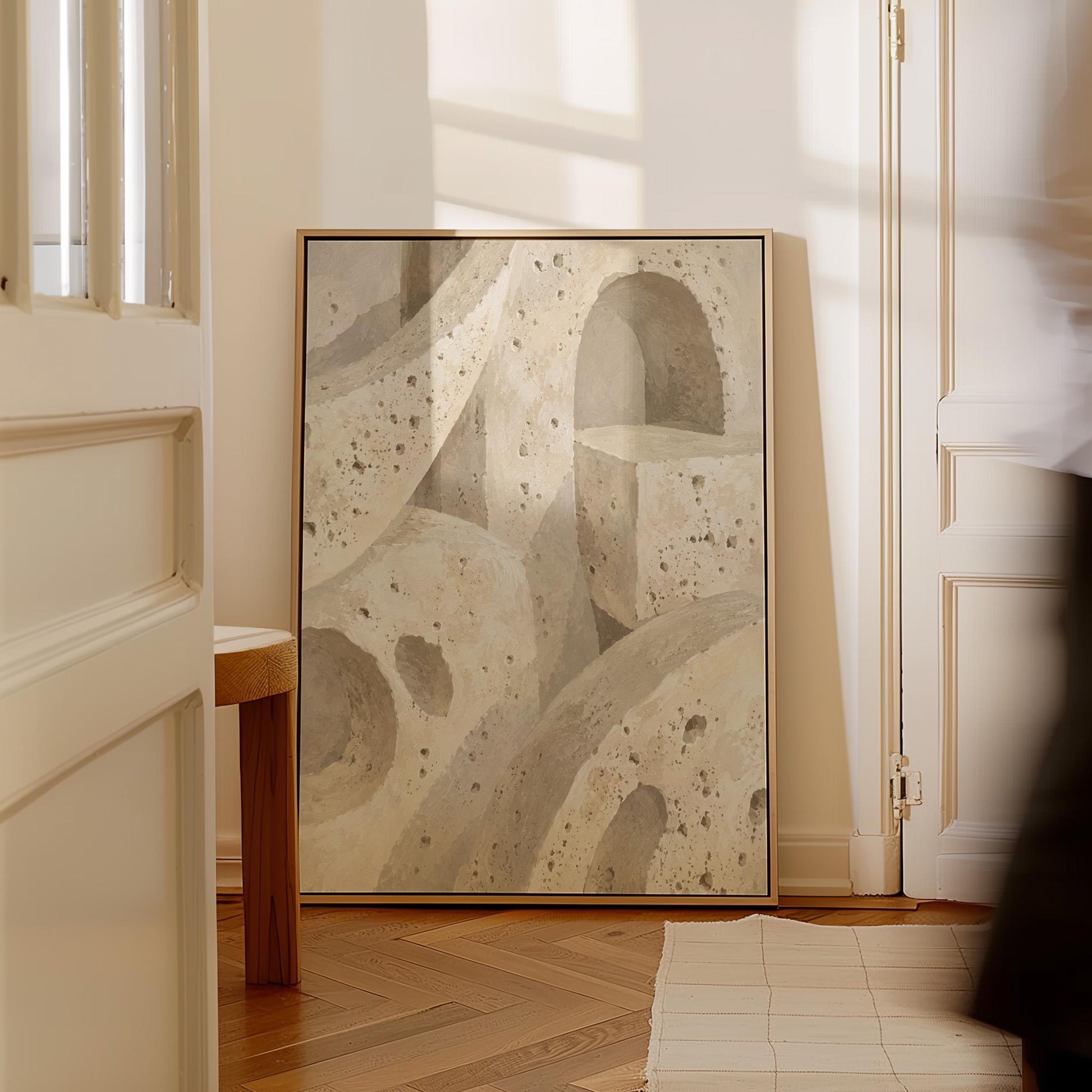 Interlocking arches and organic forms in warm speckled beige, canvas print shown to scale in a furnished room