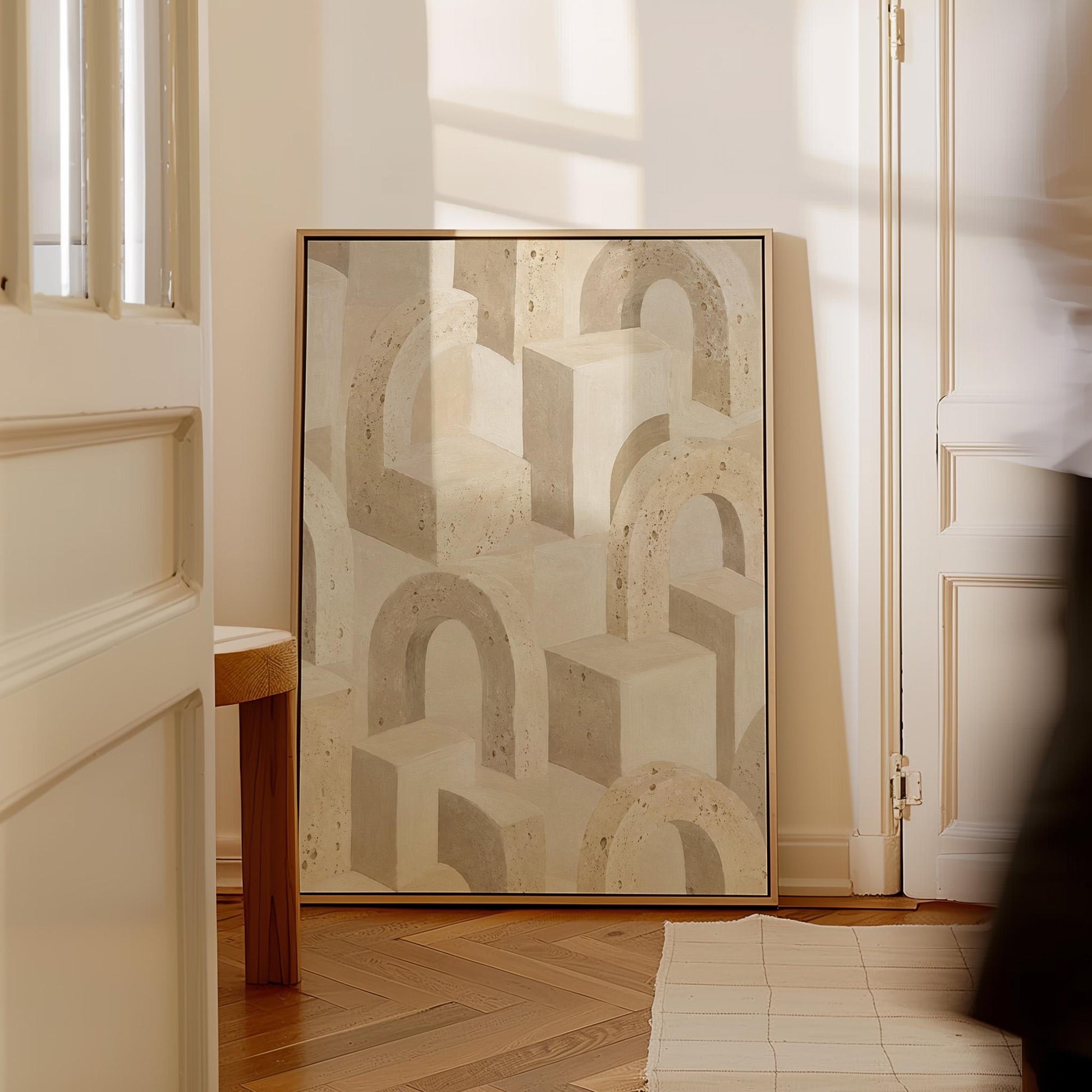Repeating small arches pattern in sand and taupe tones, canvas print on a quiet wall in a considered interior
