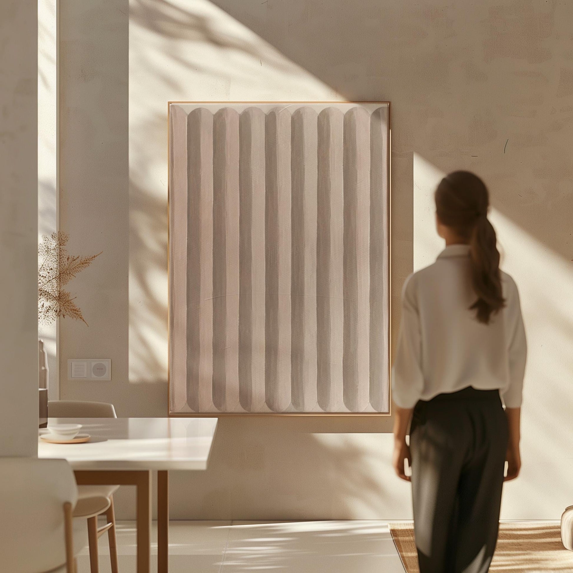 Vertical stripe pattern in blush pink and soft beige, canvas print displayed on a neutral wall in a styled interior