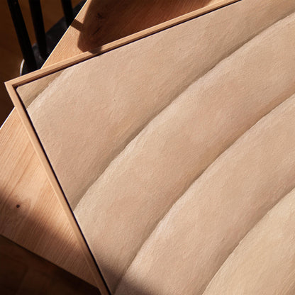 Broad sweeping arcs in cream and blush flowing across the frame, canvas print in a warm, minimally styled interior