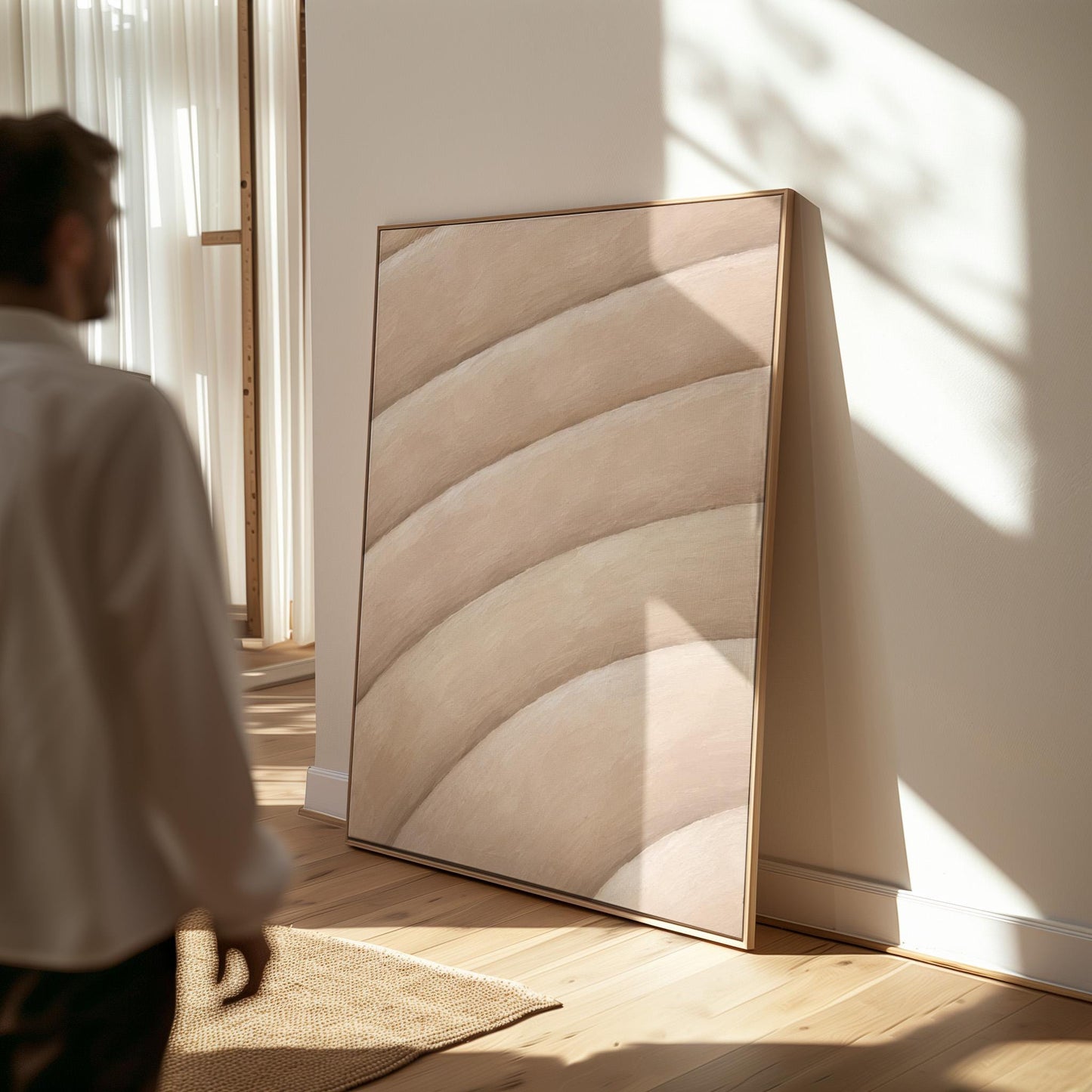 Broad sweeping arcs in cream and blush flowing across the frame, canvas print hanging in a calm, modern living space