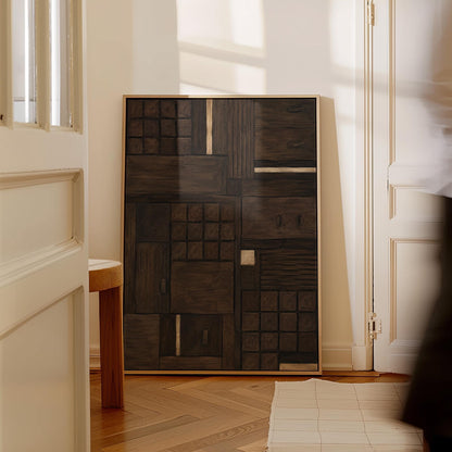 Dark espresso brown geometric patchwork with small gold accents, canvas print presented in a light, minimal room